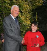 Cameron with President Dr John Locke on completion of his presentation to the club last Tuesday